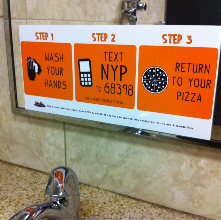 Restaurant SMS marketing campaign in bathroom at New York Pizza