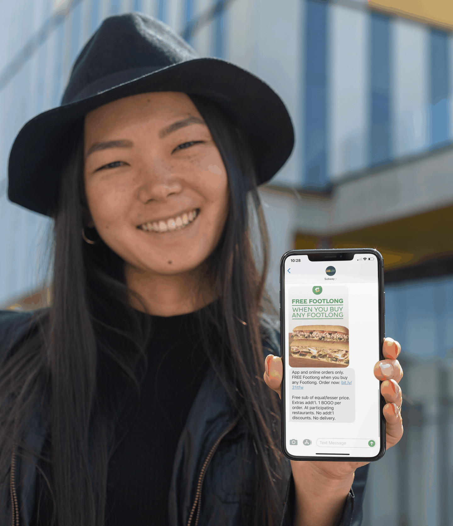 Woman with Subway Text Message Coupon